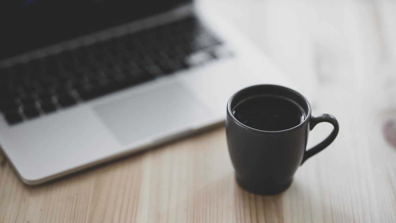 coffee and laptop on a table